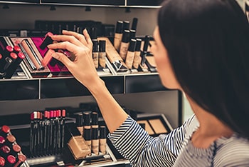 Woman shopping for cosmetics