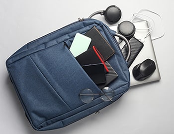 A backpack containing various tech items and gadgets